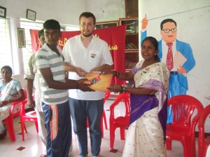 Planete Urgence Volunteer Anthony Personeni recieving a gift from his kootukural computer training students & Lalidamballe from ADECOM